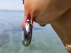 nippleringlover insane cougar extraordinary pierced puffies and pussy, switching nip rings at public beach